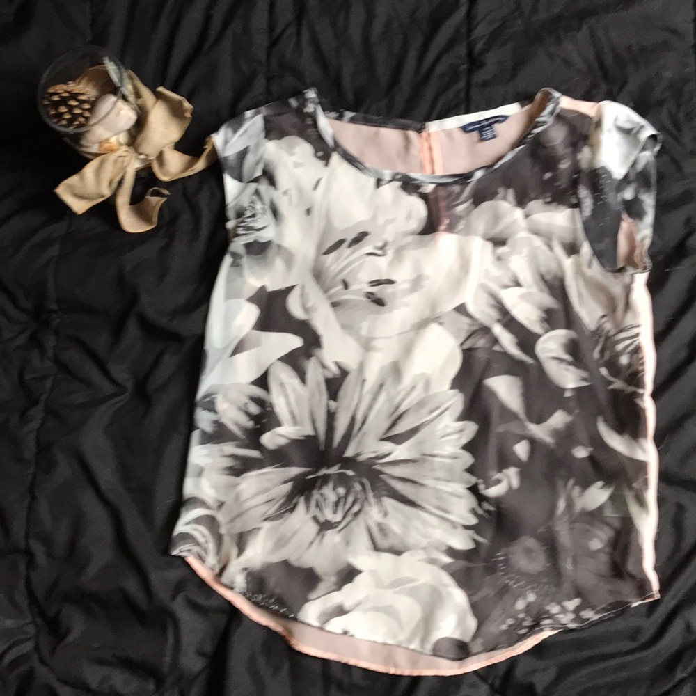 An opaque, floral patterned American Eagle shirt.